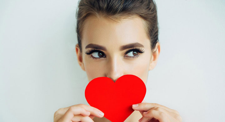Woman with heart in hand